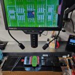 Honda CBF1000 ECU EEPROM chip under microscope during immobiliser key programming